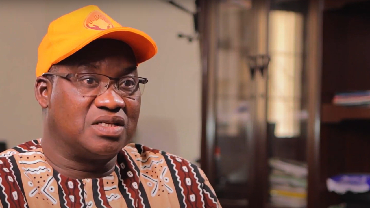 A man with a yellow cap